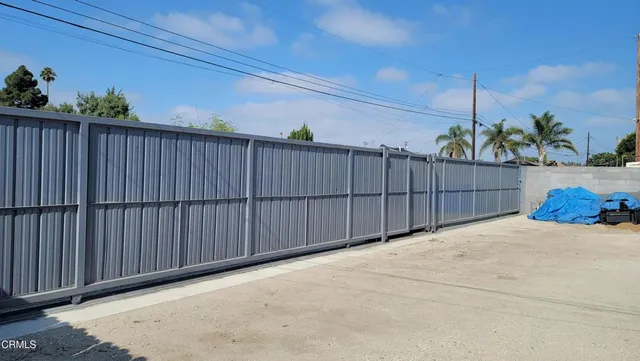 a front view of a house with a street