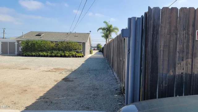 a view of a house with a sink and a yard