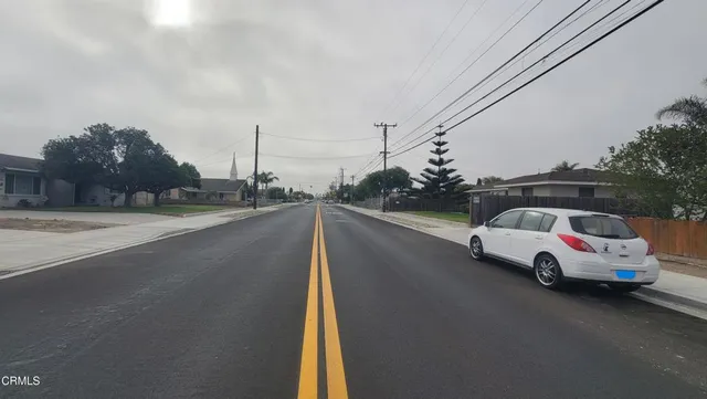 a view of a tree in front of a house