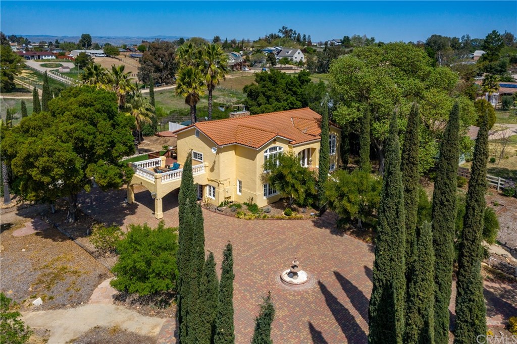 7220 Union Road Paso Robles, CA 93446 - Photo 1 of 1 Front of house view with mature landscaping and brick paver circular drive