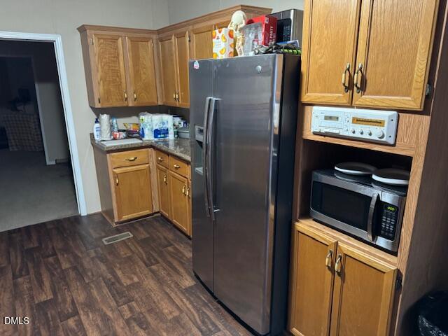 1302 Rocky Ford Road Louisburg, NC 27549 - Photo 22 of 26 a kitchen with stainless steel appliances a refrigerator and a stove top oven