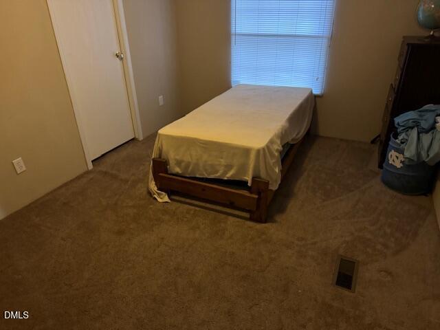 1302 Rocky Ford Road Louisburg, NC 27549 - Photo 26 of 26 a bedroom with a bed and a window