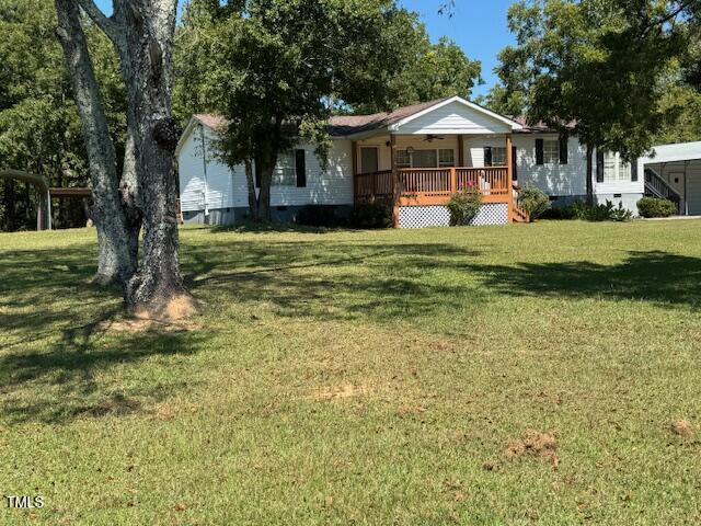 1302 Rocky Ford Road Louisburg, NC 27549 - Photo 3 of 26 a front view of a house with a yard