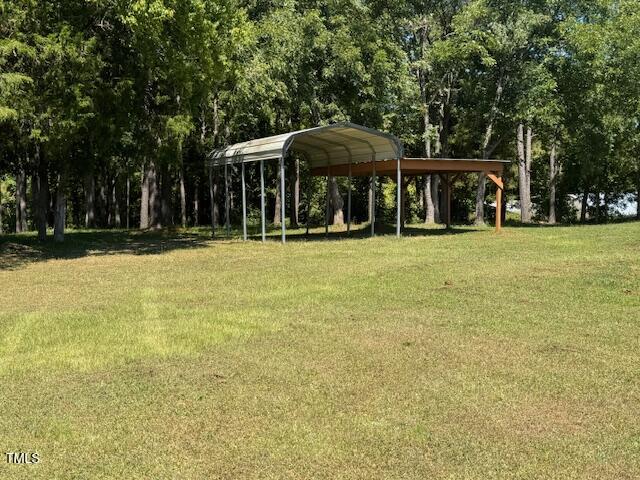 1302 Rocky Ford Road Louisburg, NC 27549 - Photo 6 of 26 a front view of a house with a yard
