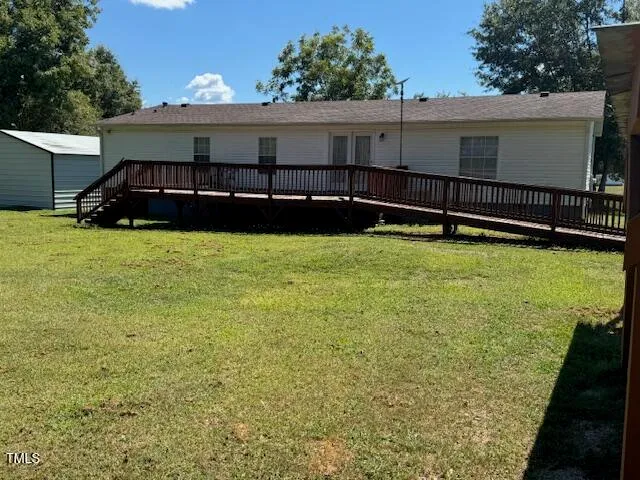 a view of a backyard of the house
