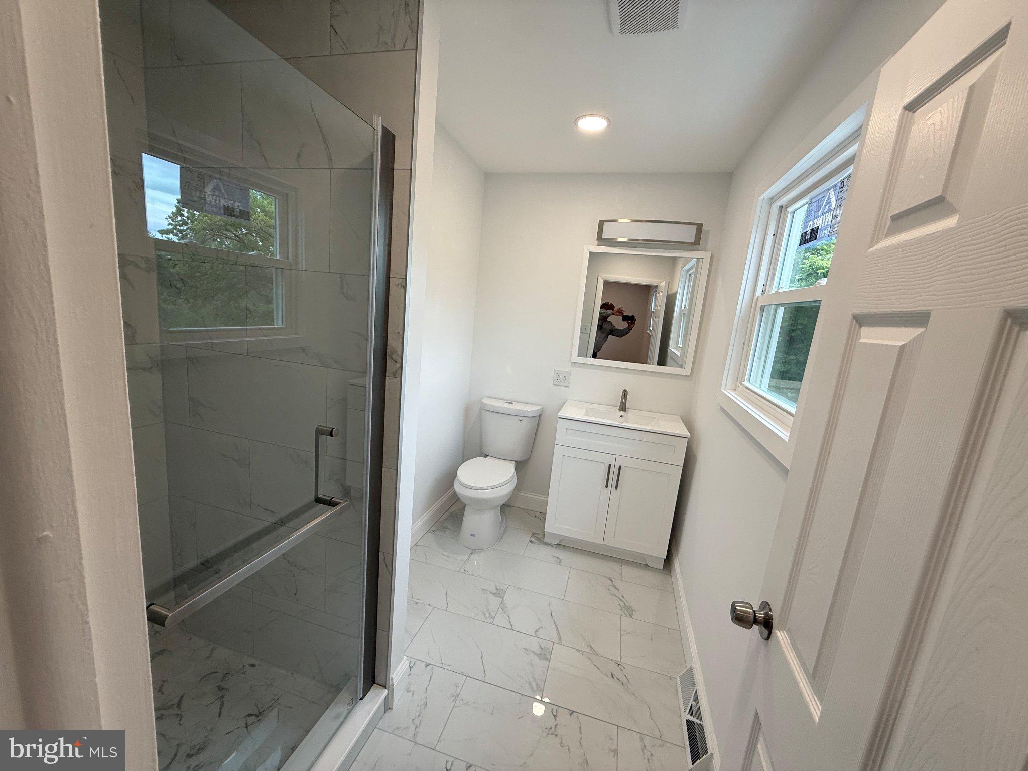 1104 Church Road Wyncote, PA 19095 - Photo 14 of 31 a bathroom with a sink a toilet and shower