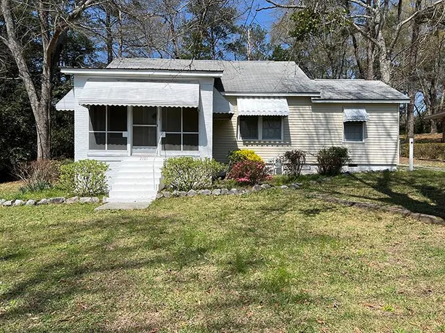 front view of a house with a yard