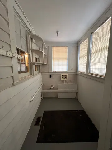 a kitchen with a white cabinets and sink