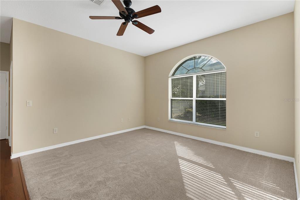 3715 Mulberry Grove Loop Leesburg, FL 34748 - Photo 11 of 48 a view of an empty room with a window