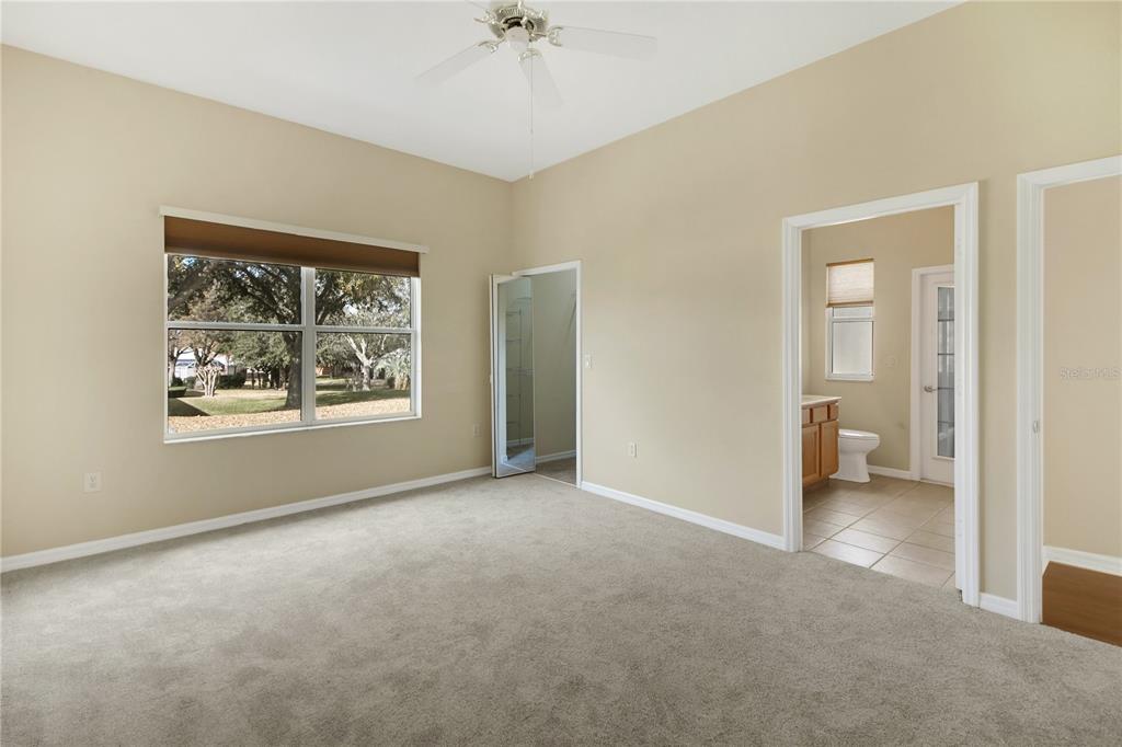 3715 Mulberry Grove Loop Leesburg, FL 34748 - Photo 15 of 48 a view of an empty room with a window
