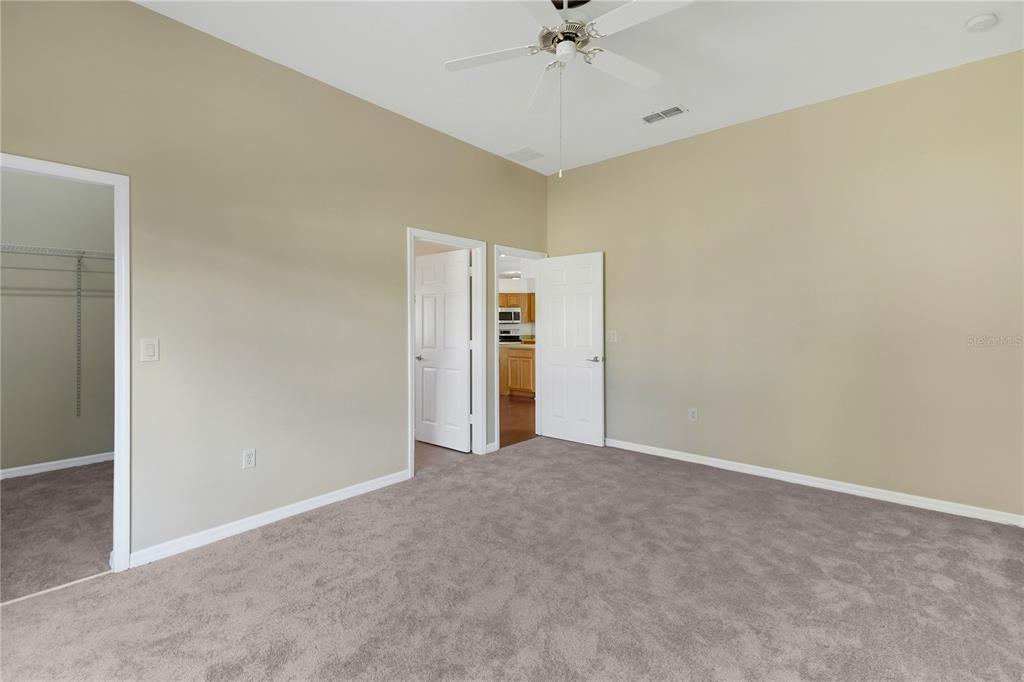 3715 Mulberry Grove Loop Leesburg, FL 34748 - Photo 17 of 48 a view of an empty room with a bathroom