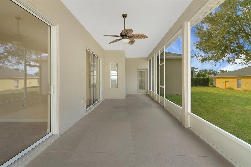 3715 Mulberry Grove Loop Leesburg, FL 34748 - Photo 21 of 48 a view of a hallway with a chandelier