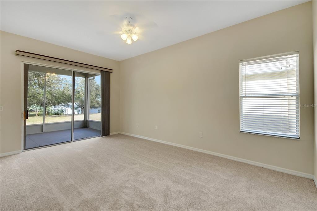 3715 Mulberry Grove Loop Leesburg, FL 34748 - Photo 27 of 48 a view of an empty room with a window
