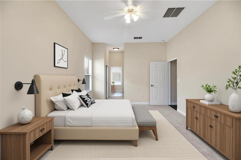3715 Mulberry Grove Loop Leesburg, FL 34748 - Photo 29 of 48 a bedroom with a bed and a chandelier