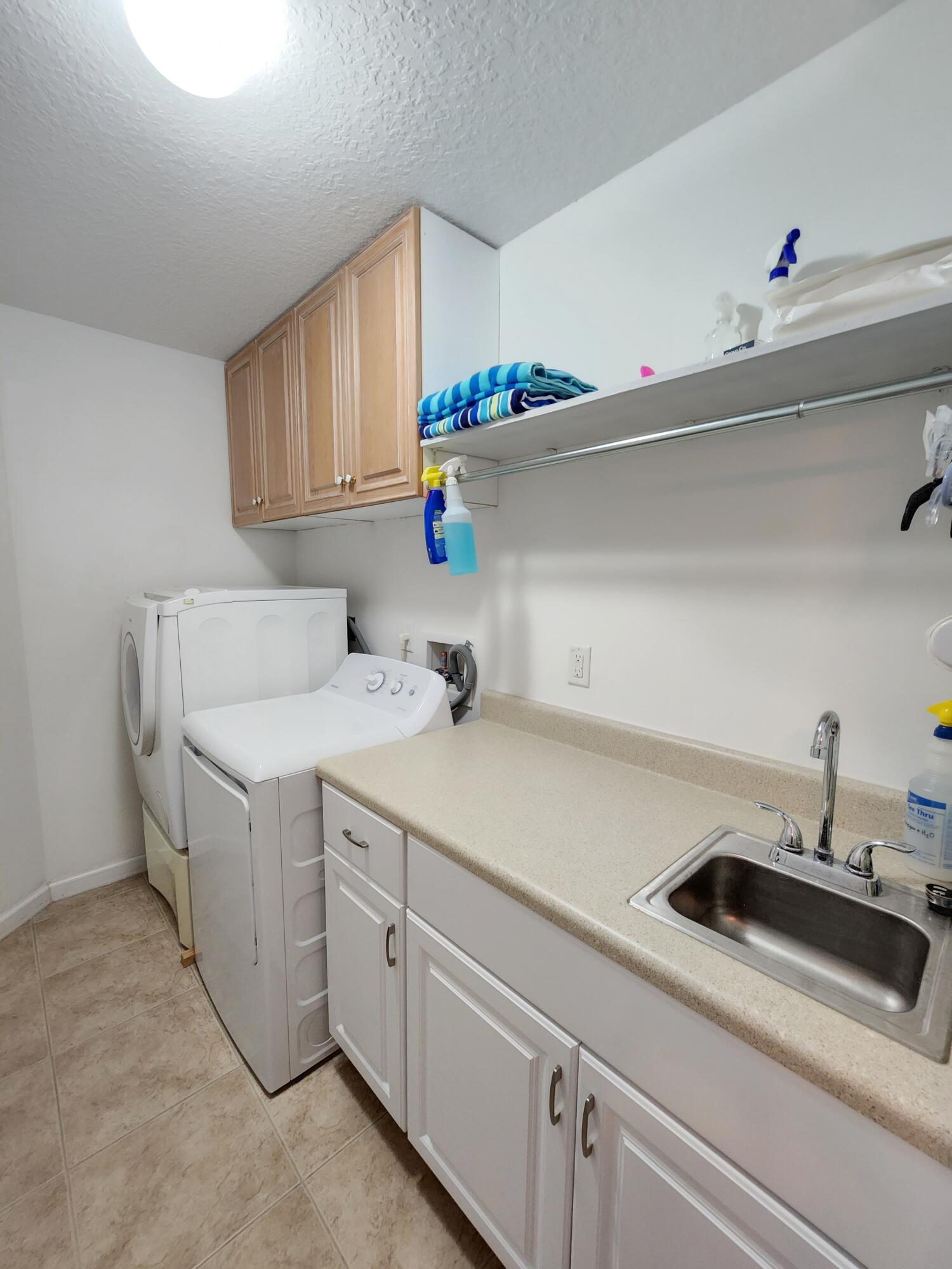 2584 Southwest Impala Way Stuart, FL 34997 - Photo 35 of 72 Laundry room with sink