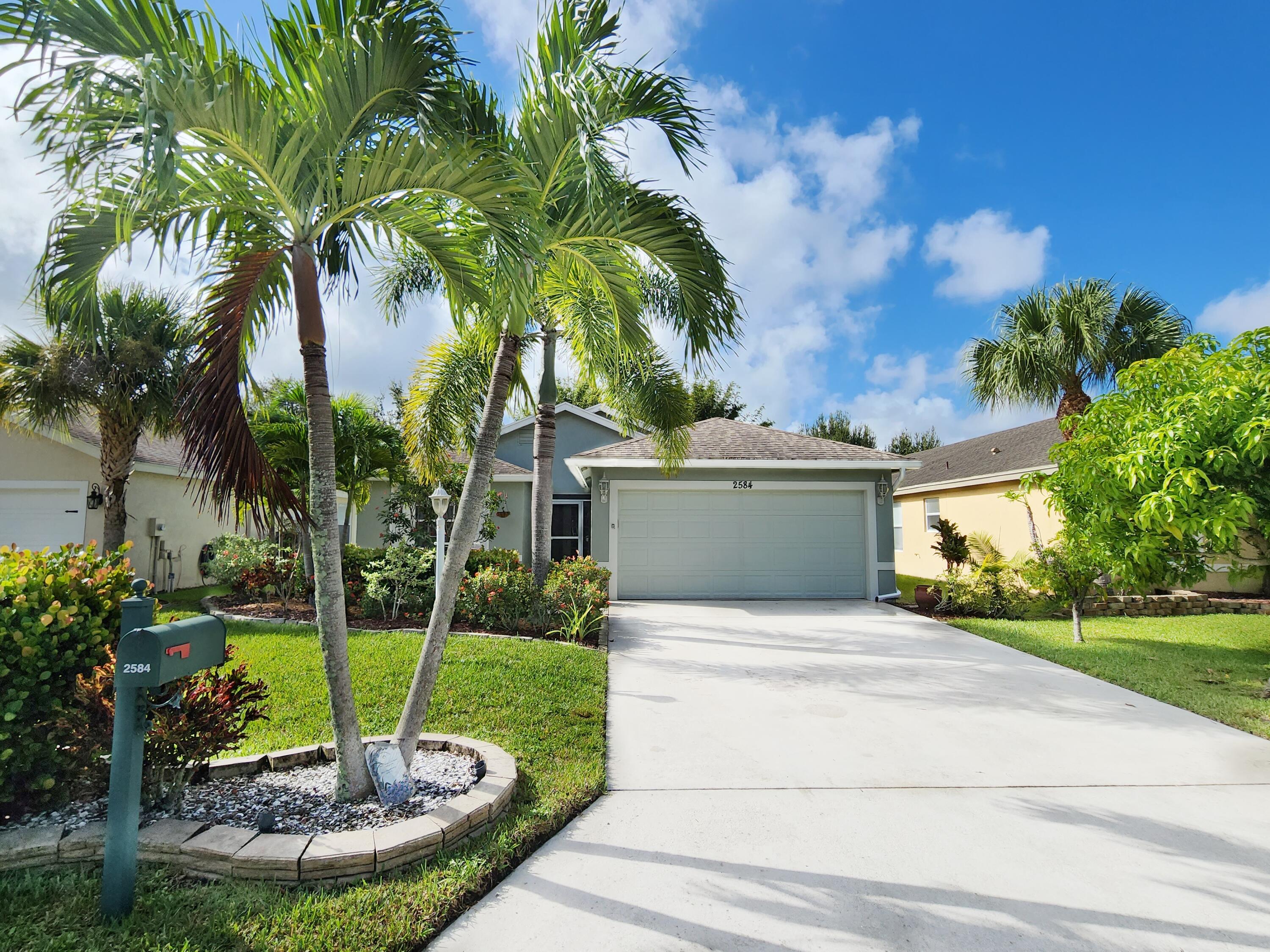 2584 Southwest Impala Way Stuart, FL 34997 - Photo 47 of 72 Long 4 car driveway