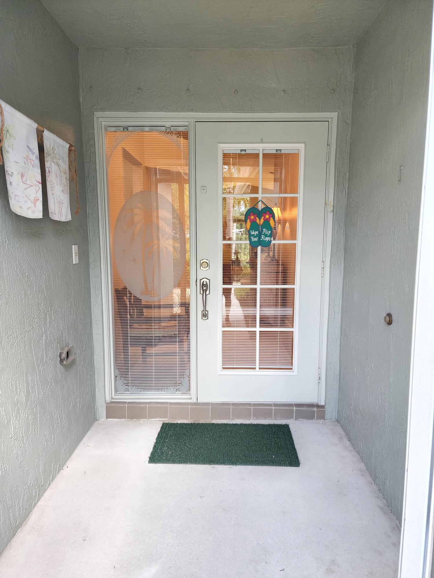 2584 Southwest Impala Way Stuart, FL 34997 - Photo 5 of 72 Front screen enclosed entrance