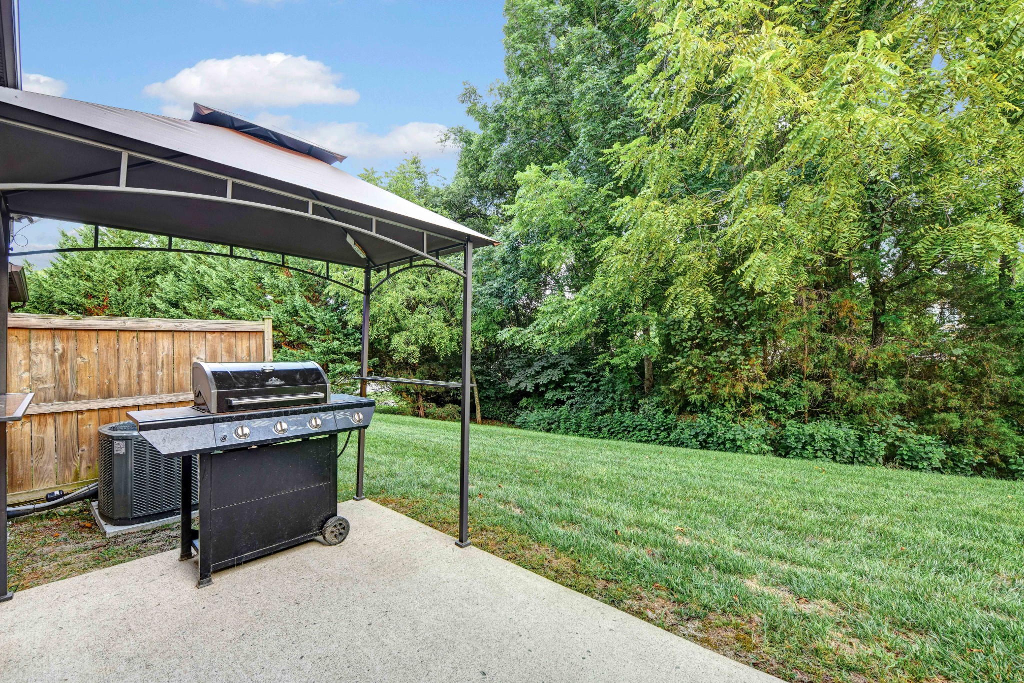 305 Windgrove Terrace Mount Juliet, TN 37122 - Photo 18 of 20 a patio with table and chairs