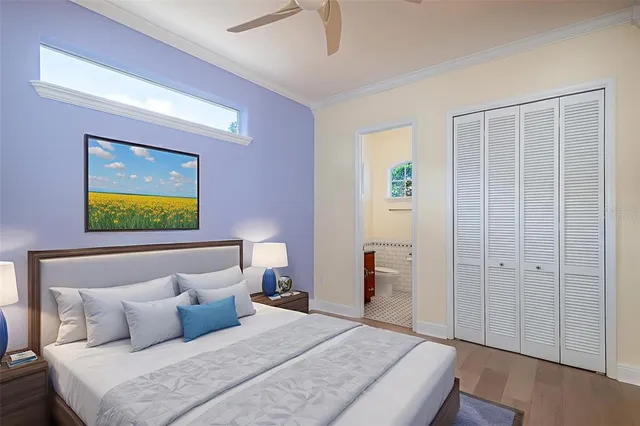 a bathroom with a granite countertop toilet a sink a mirror and a window