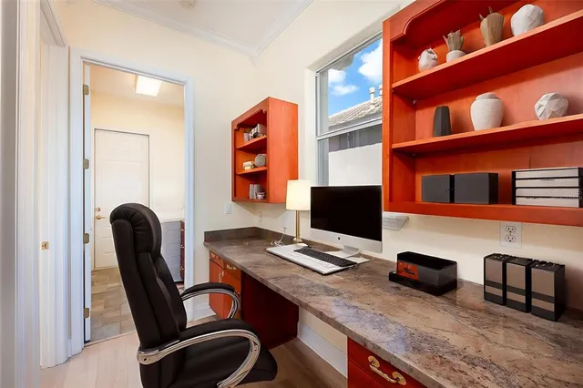 a kitchen with stainless steel appliances granite countertop a sink and a refrigerator