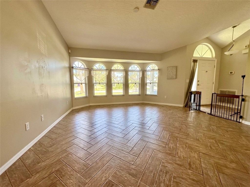 686 Caravan Terrace Sebastian, FL 32958 - Photo 11 of 24 a view of an entryway with wooden floor