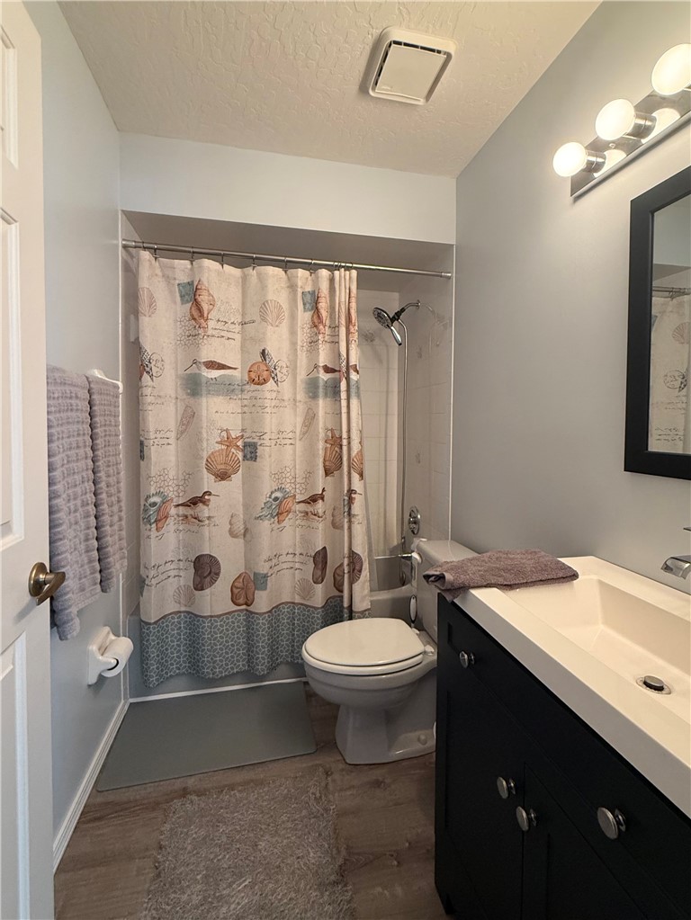 686 Caravan Terrace Sebastian, FL 32958 - Photo 16 of 24 a bathroom with a double vanity sink toilet and shower