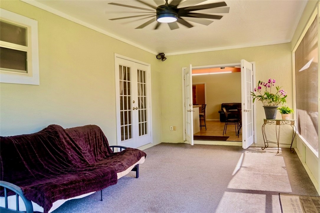 686 Caravan Terrace Sebastian, FL 32958 - Photo 21 of 24 a living room with a couch and a dining table