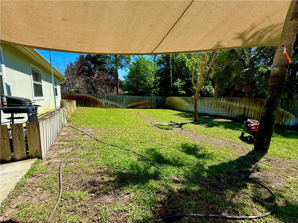 686 Caravan Terrace Sebastian, FL 32958 - Photo 23 of 24 a view of a backyard with a fountain