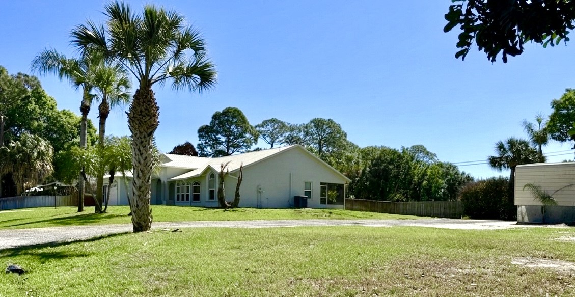 686 Caravan Terrace Sebastian, FL 32958 - Photo 5 of 24 a house with garden in front of it