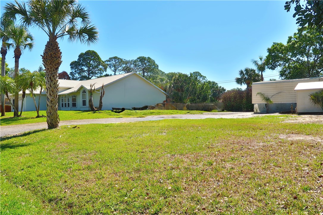 686 Caravan Terrace Sebastian, FL 32958 - Photo 7 of 24 a view of a swimming pool with an outdoor space and seating area