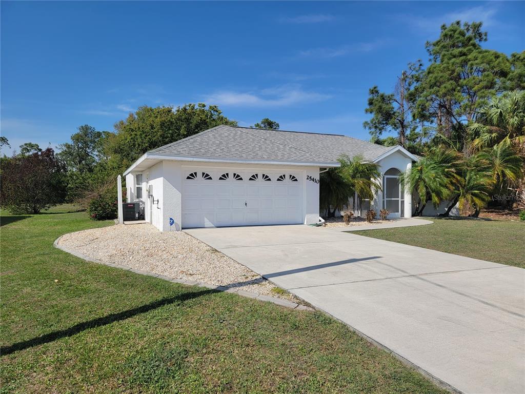 25410 Rancagua Drive Punta Gorda, FL 33983 - Photo 1 of 1 a front view of a house with a yard