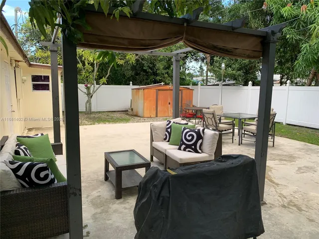 a view of outdoor space with seating and green space