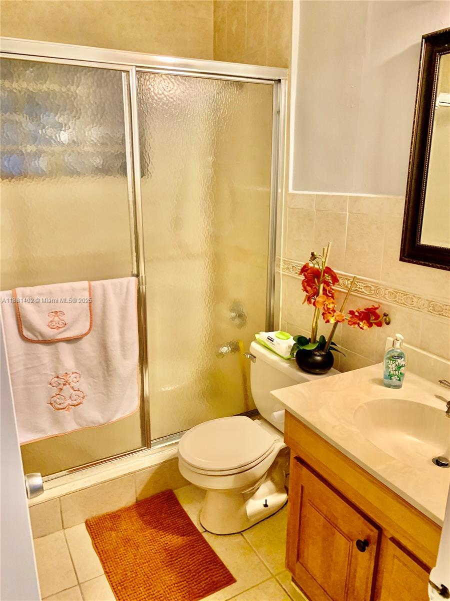 6180 Southwest 42nd Court Davie, FL 33314 - Photo 17 of 25 a bathroom with a sink and a shower curtain