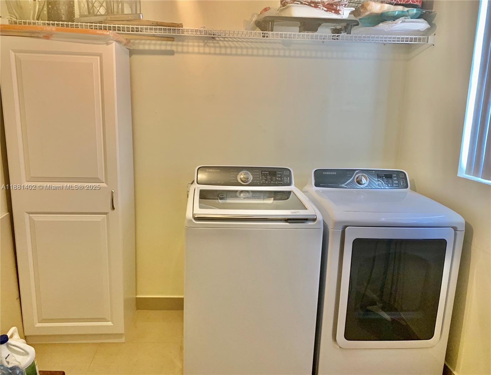 6180 Southwest 42nd Court Davie, FL 33314 - Photo 18 of 25 a utility room with dryer and washer
