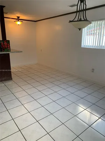 a view of a room and window