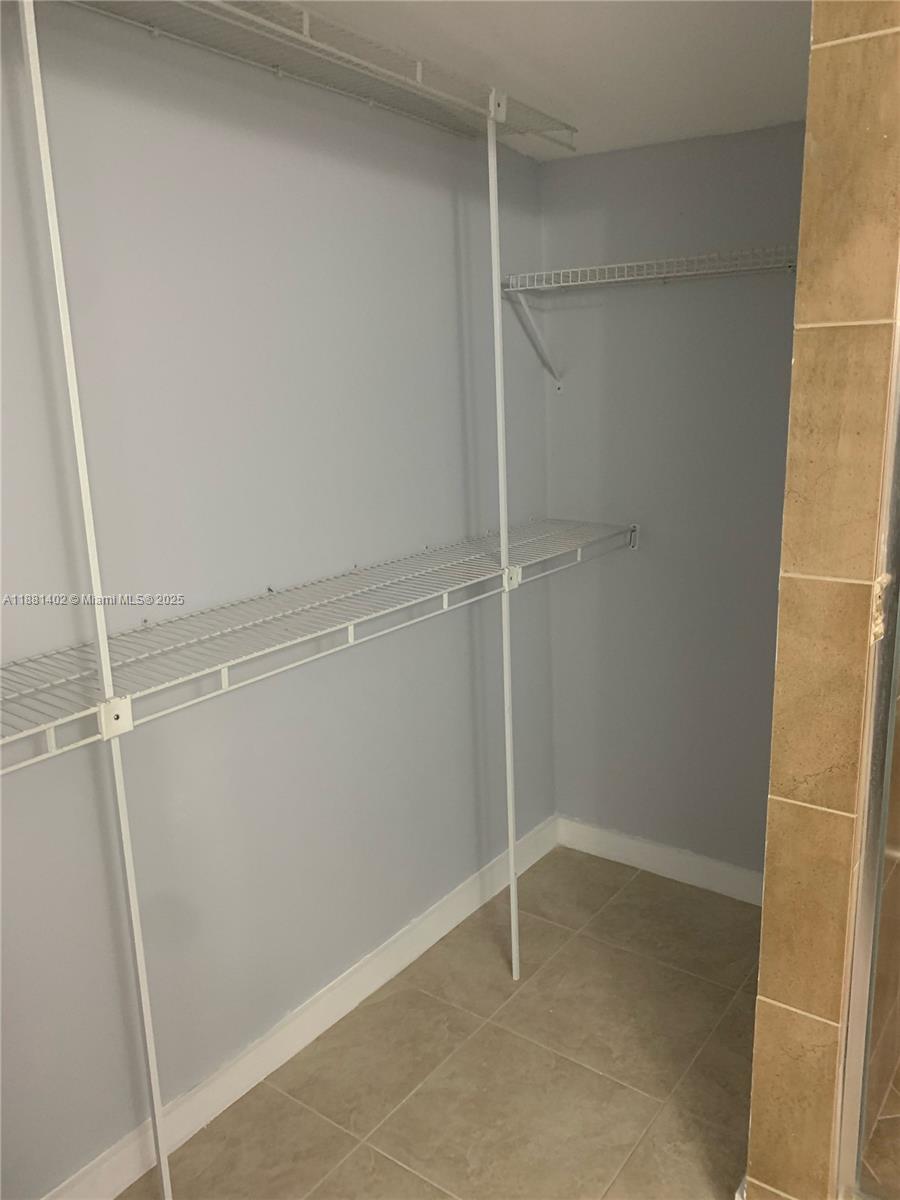 6180 Southwest 42nd Court Davie, FL 33314 - Photo 23 of 25 a view of an empty walk in closet