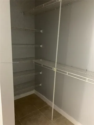 a empty closet with white paint