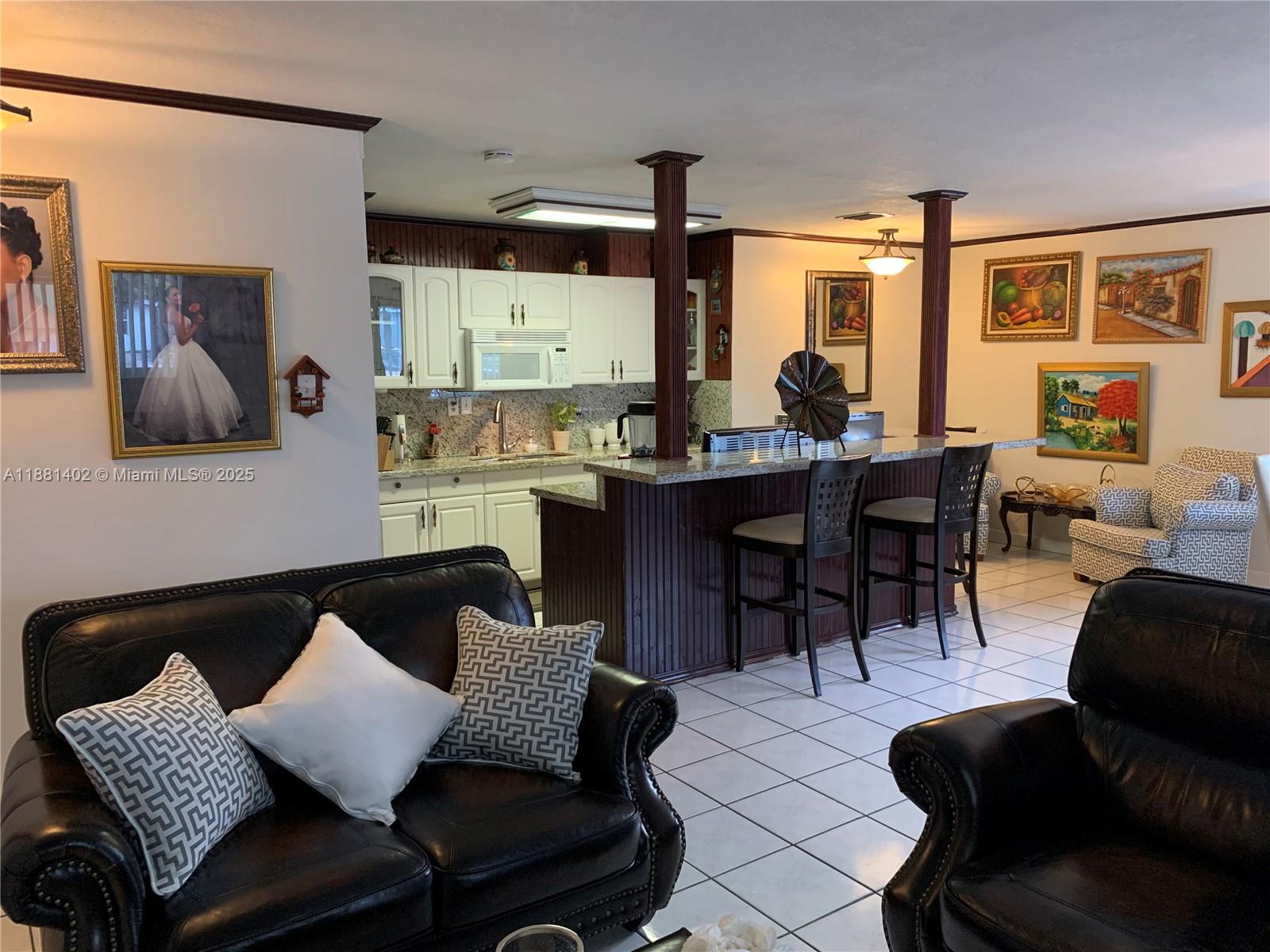 6180 Southwest 42nd Court Davie, FL 33314 - Photo 4 of 25 a living room with furniture and a large window