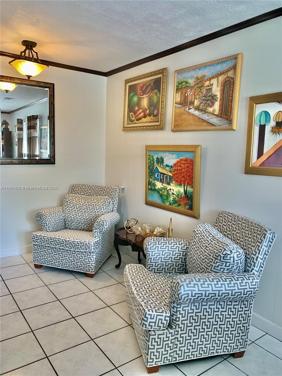 6180 Southwest 42nd Court Davie, FL 33314 - Photo 10 of 25 a living room with furniture and wall paintings