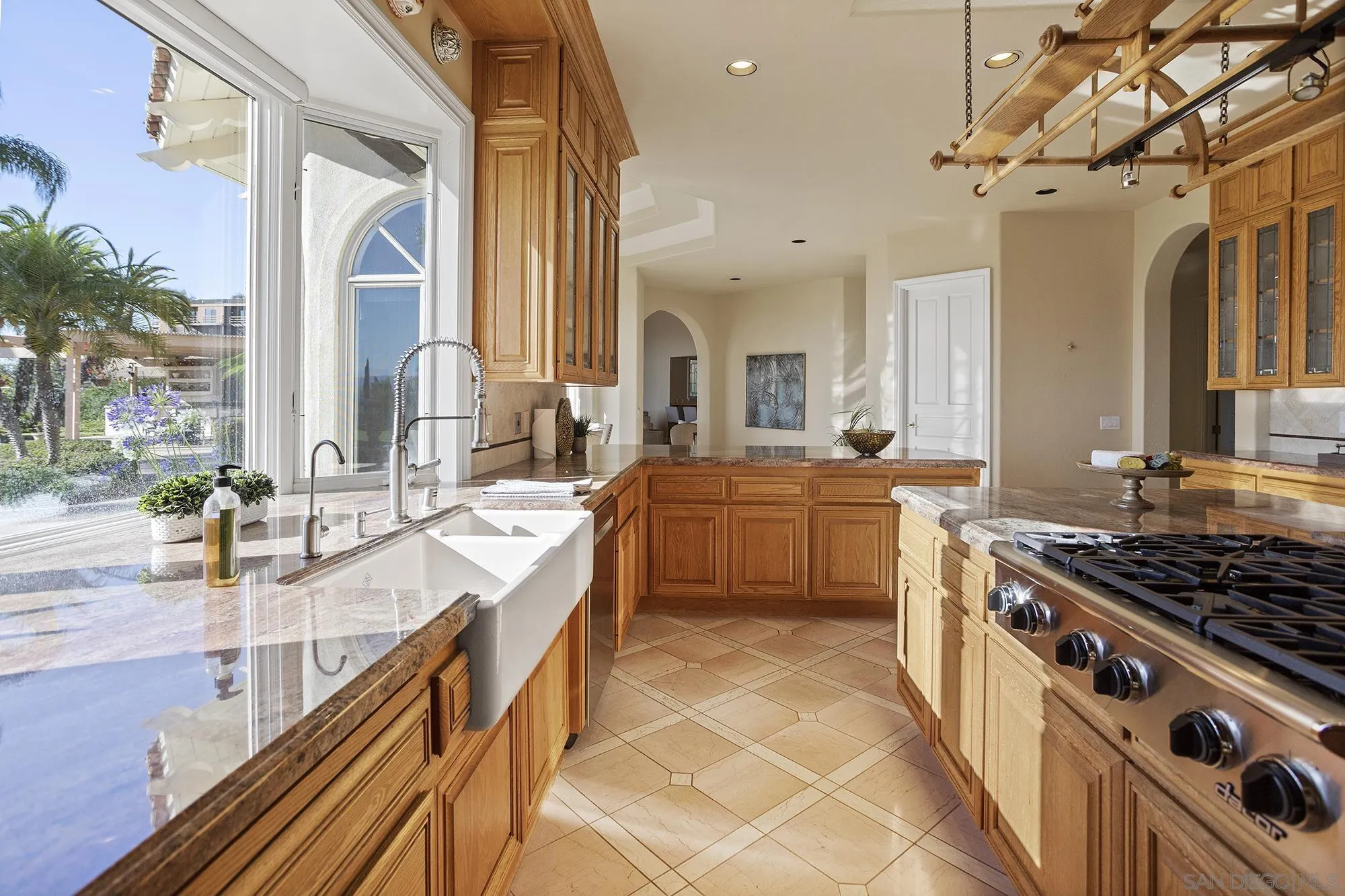 4 Rollingview Lane Fallbrook, CA 92028 - Photo 11 of 32 a kitchen with stainless steel appliances kitchen island granite countertop a sink and cabinets