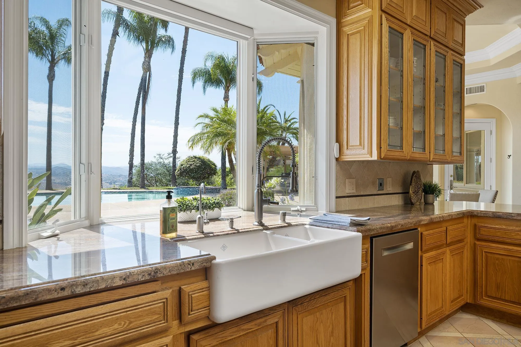 4 Rollingview Lane Fallbrook, CA 92028 - Photo 12 of 32 a kitchen with a sink and a large window