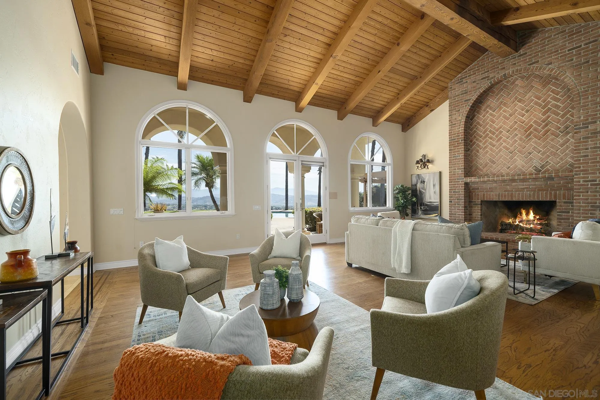 4 Rollingview Lane Fallbrook, CA 92028 - Photo 16 of 32 a living room with fireplace furniture and a chandelier