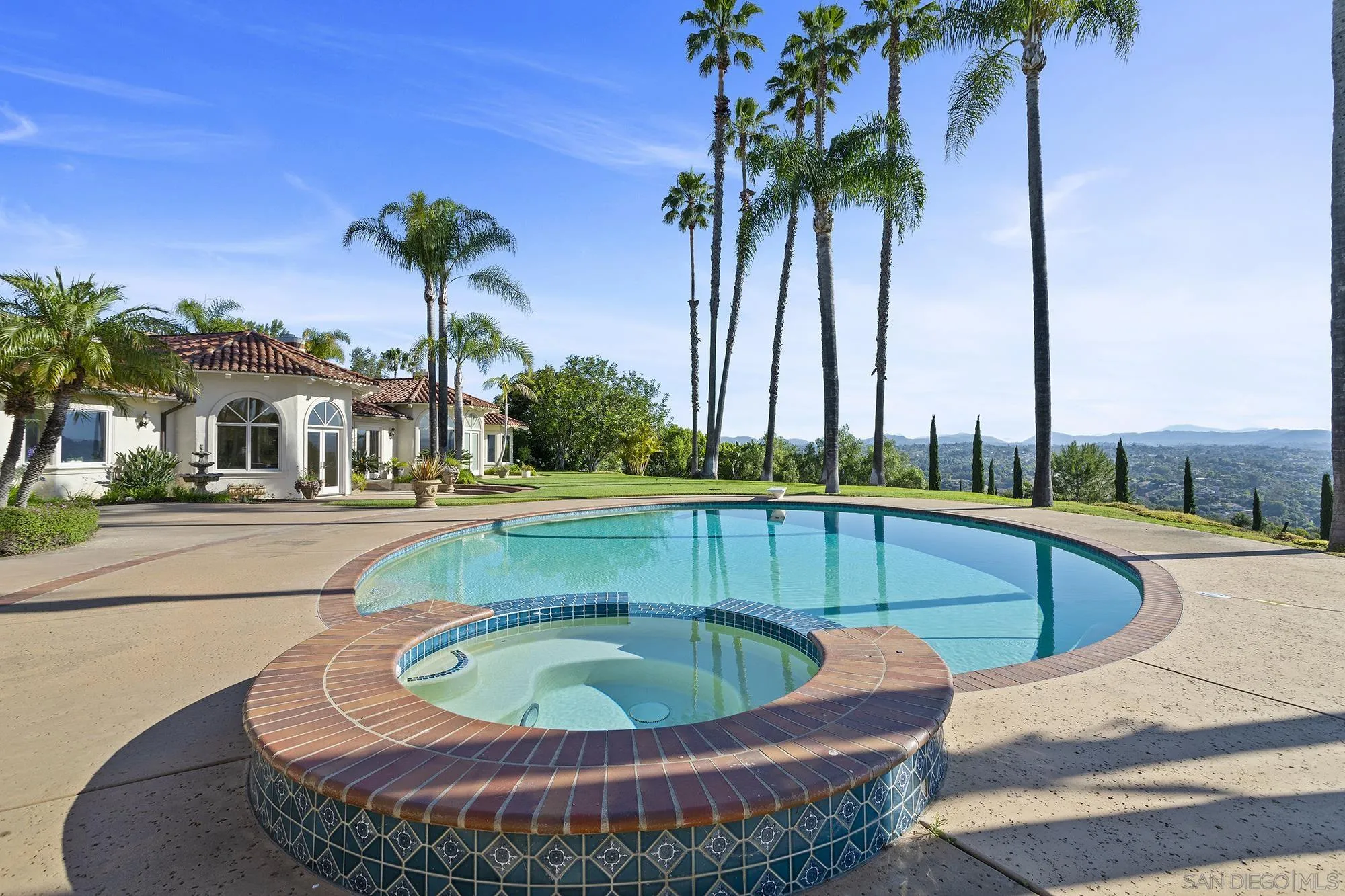4 Rollingview Lane Fallbrook, CA 92028 - Photo 23 of 32 a view of a swimming pool with a yard and palm trees