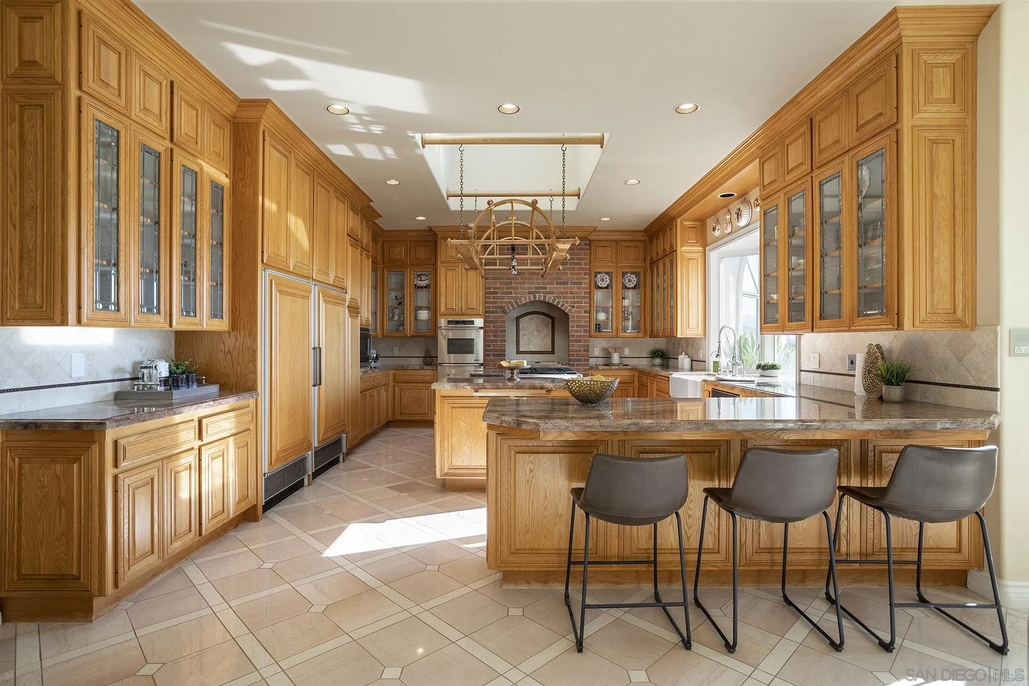 4 Rollingview Lane Fallbrook, CA 92028 - Photo 8 of 32 a kitchen with center island table and chairs
