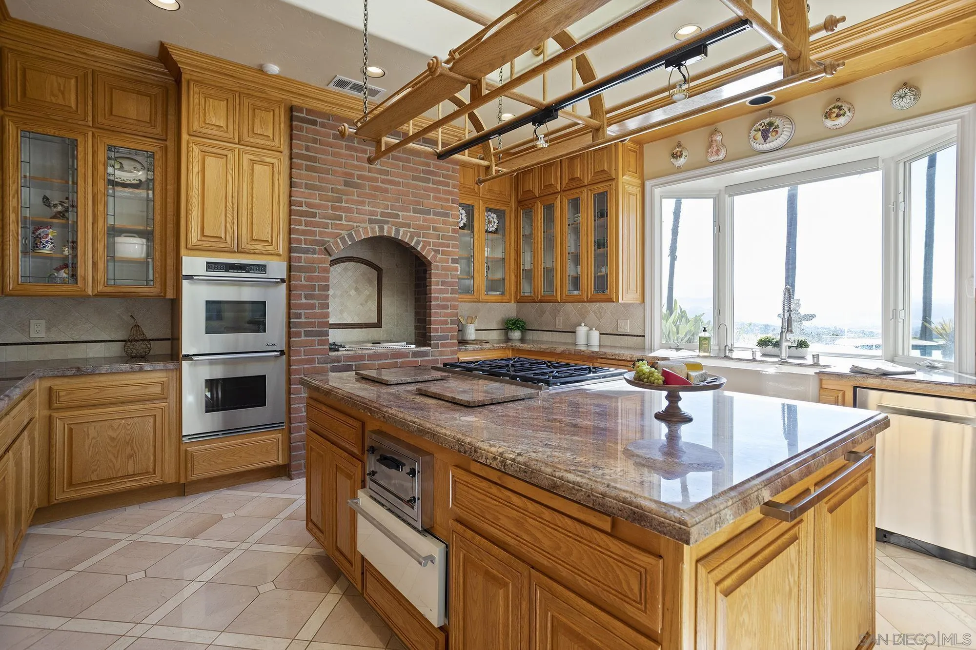 4 Rollingview Lane Fallbrook, CA 92028 - Photo 10 of 32 a kitchen with a stove a sink and a refrigerator