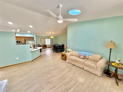 a view of a patio with table and chairs under an umbrella