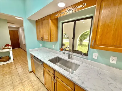 a bedroom with a bed and flat screen tv