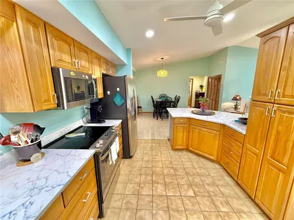 a view of walk in closet with clothes