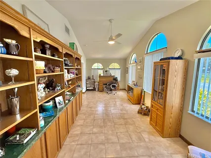 a bathroom with a sink mirror and vanity