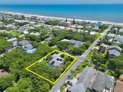 a view of a garden with a building in the background